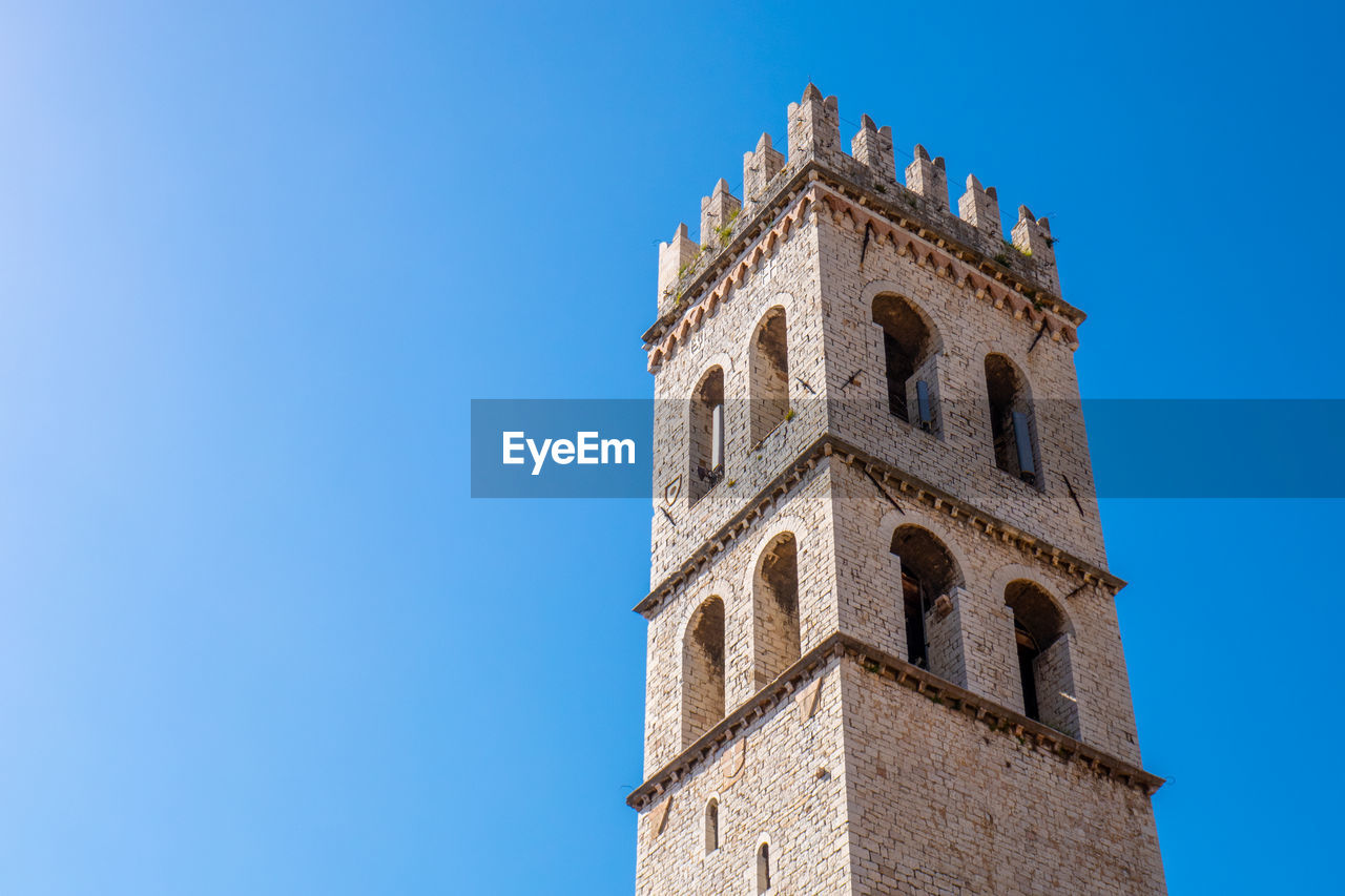 The tall tower of popolo, in the main square of assisi, italy.