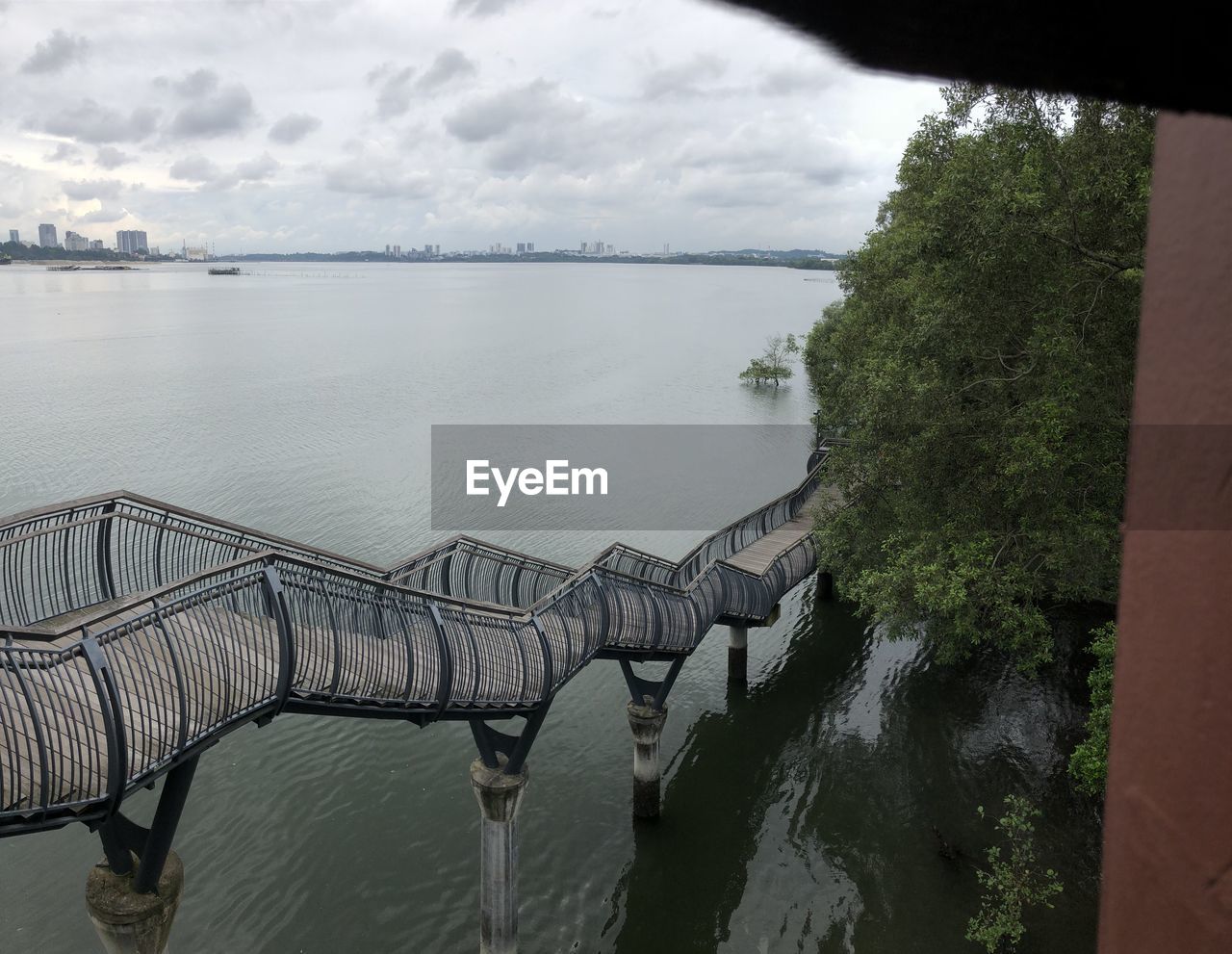 water, cloud, sky, nature, architecture, sea, reflection, beauty in nature, scenics - nature, tree, no people, plant, tranquility, built structure, environment, travel destinations, outdoors, travel, day, landscape, tourism, land, tranquil scene, bridge, reservoir, transportation, beach