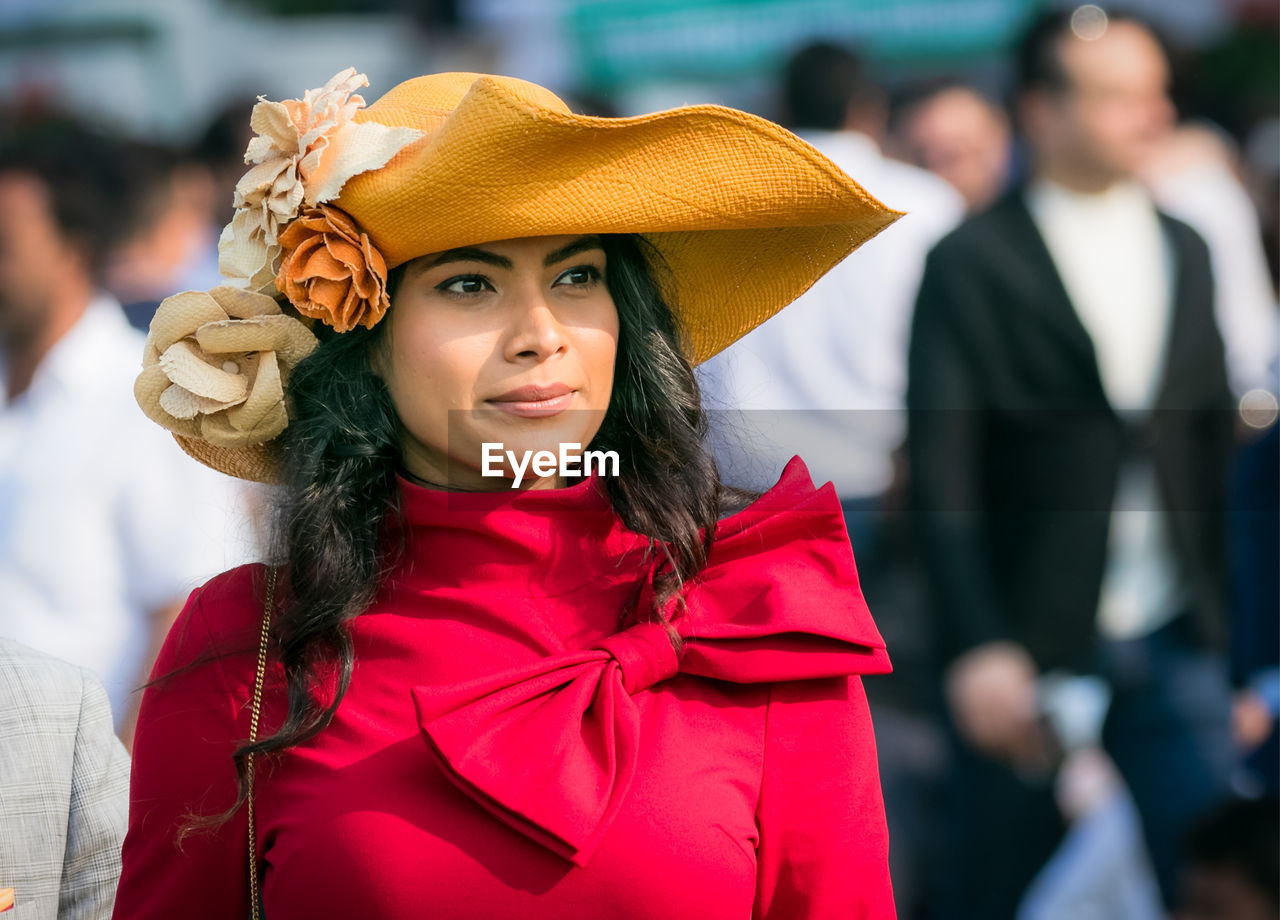 PORTRAIT OF YOUNG WOMAN WITH HAT