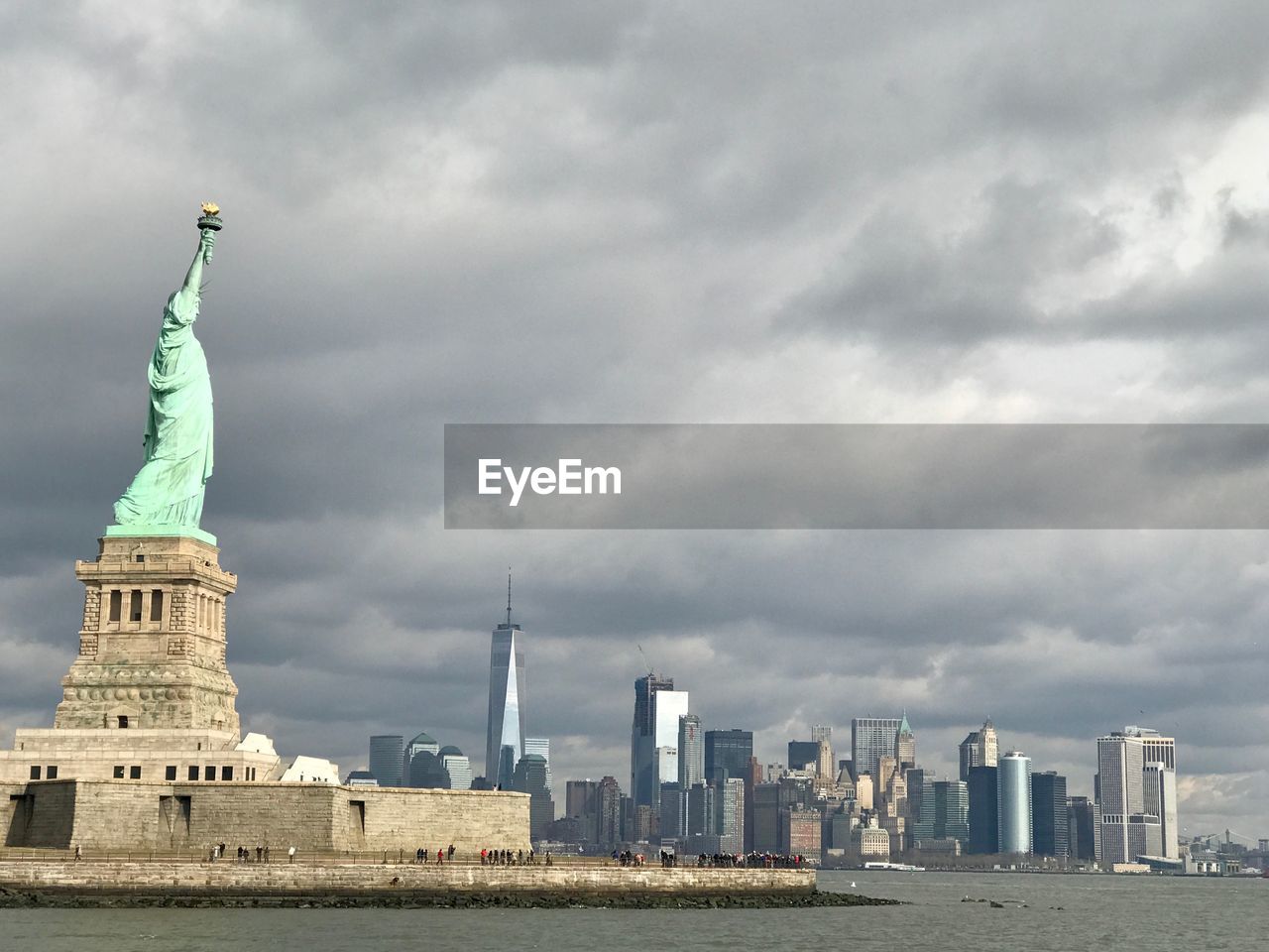 Low angle view of statue of liberty against sky