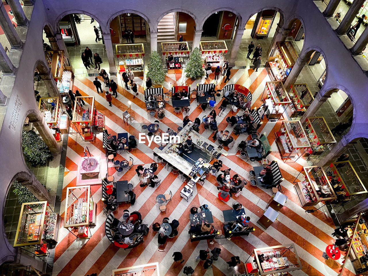 HIGH ANGLE VIEW OF PEOPLE IN CITY AT SHOPPING MALL