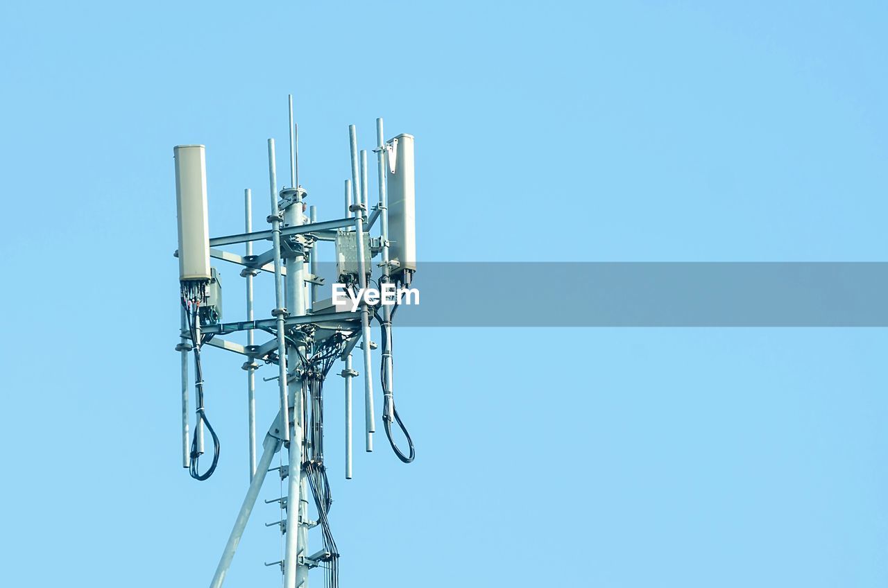 Low angle view of television tower against clear blue sky