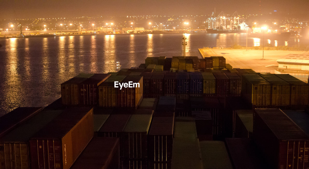 Cargo containers at harbor during night
