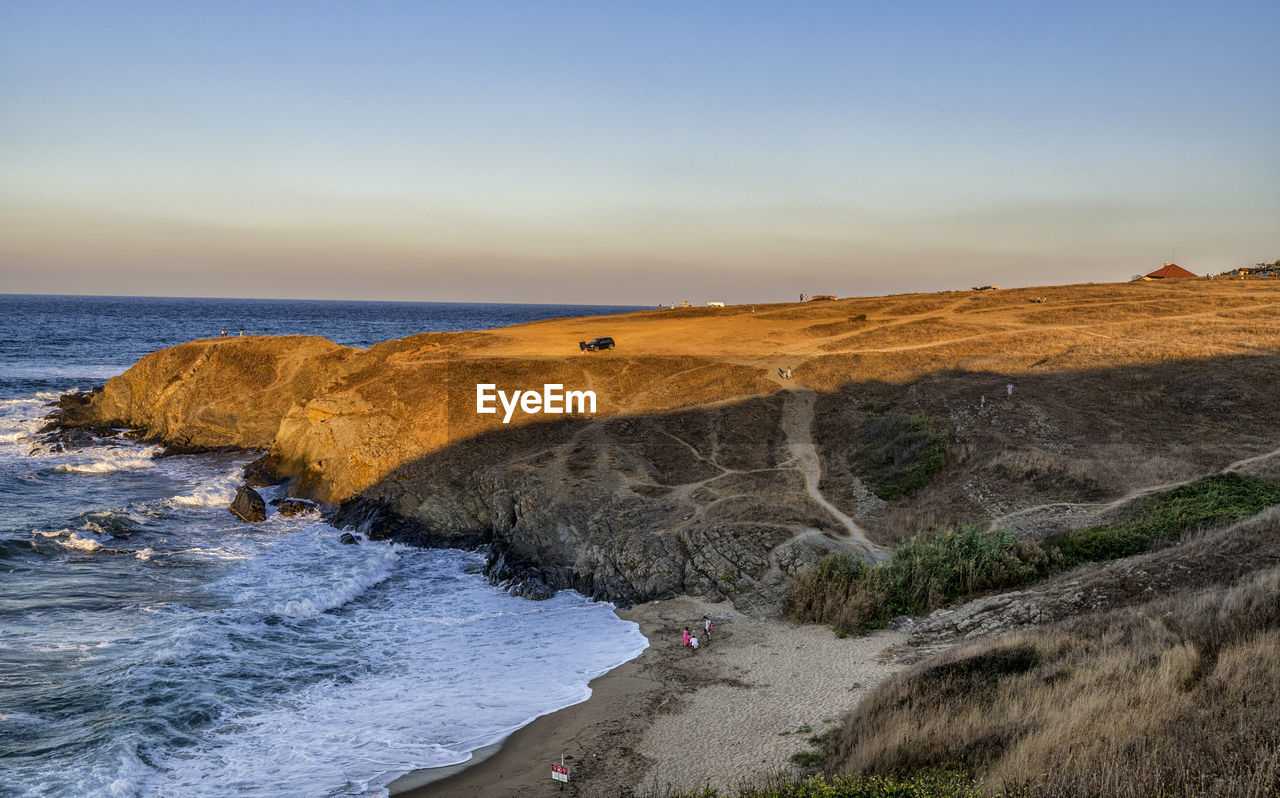 Scenic view of beach against sky