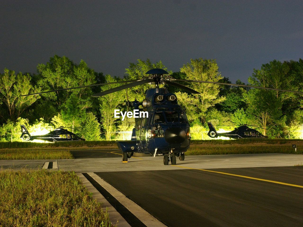 Helicopters in airport at night