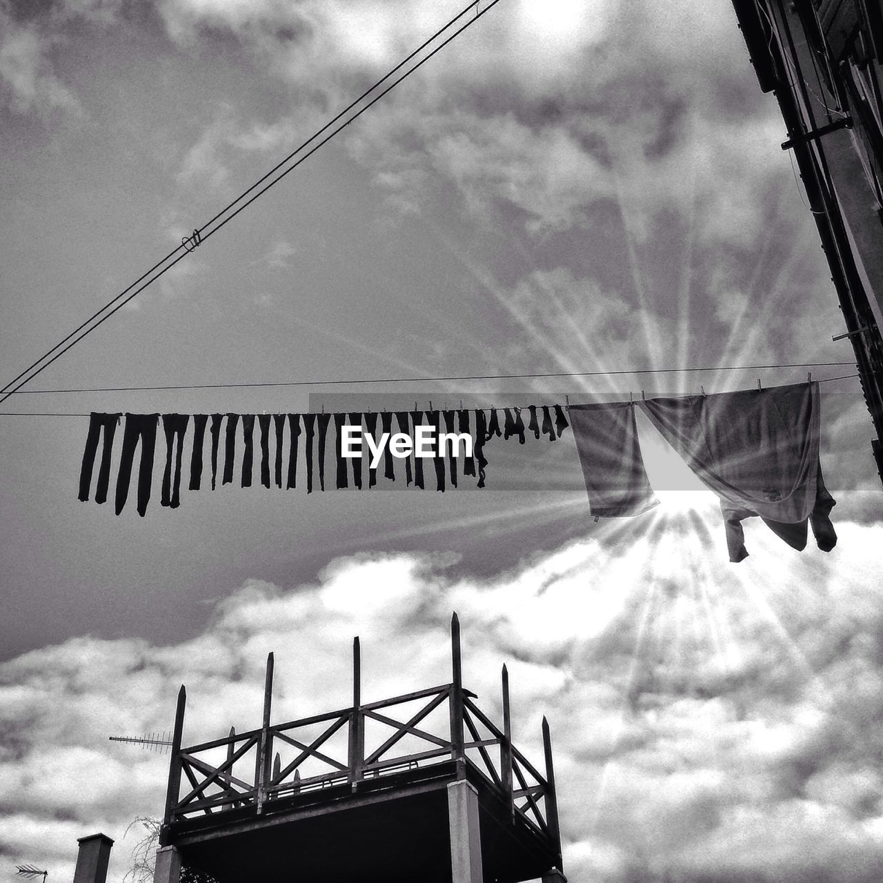 Laundry drying on clothesline in backyard