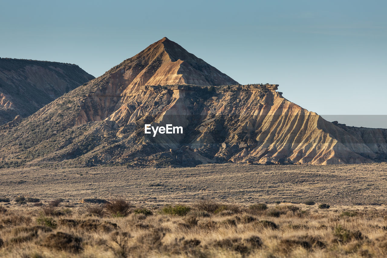 Scenic view of rocky mountains against clear sky