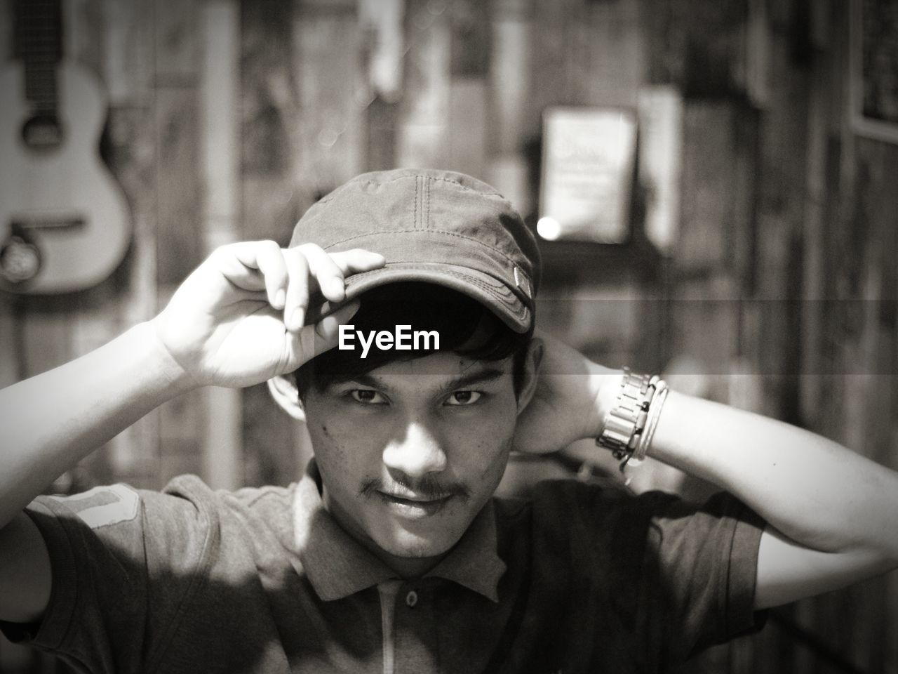 Portrait of young man wearing cap