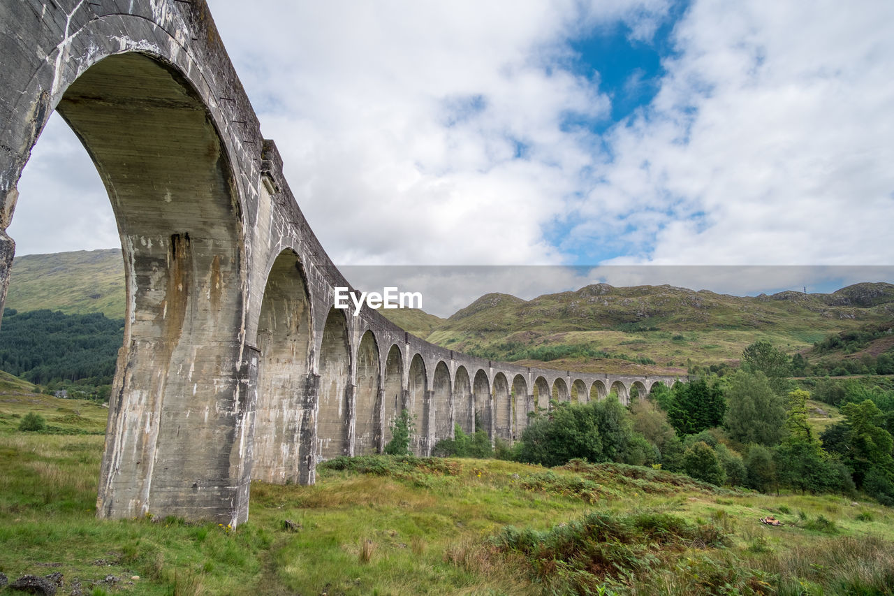 ARCH BRIDGE OVER LANDSCAPE