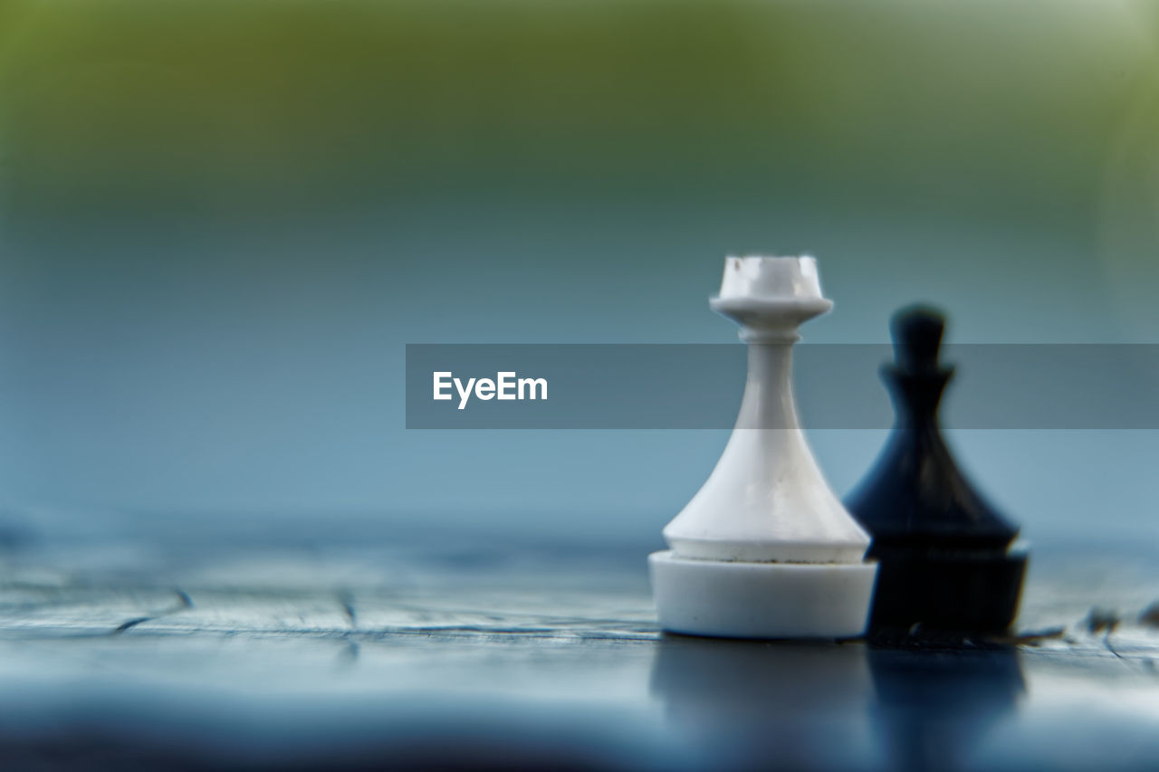 Close-up of chess pieces on table