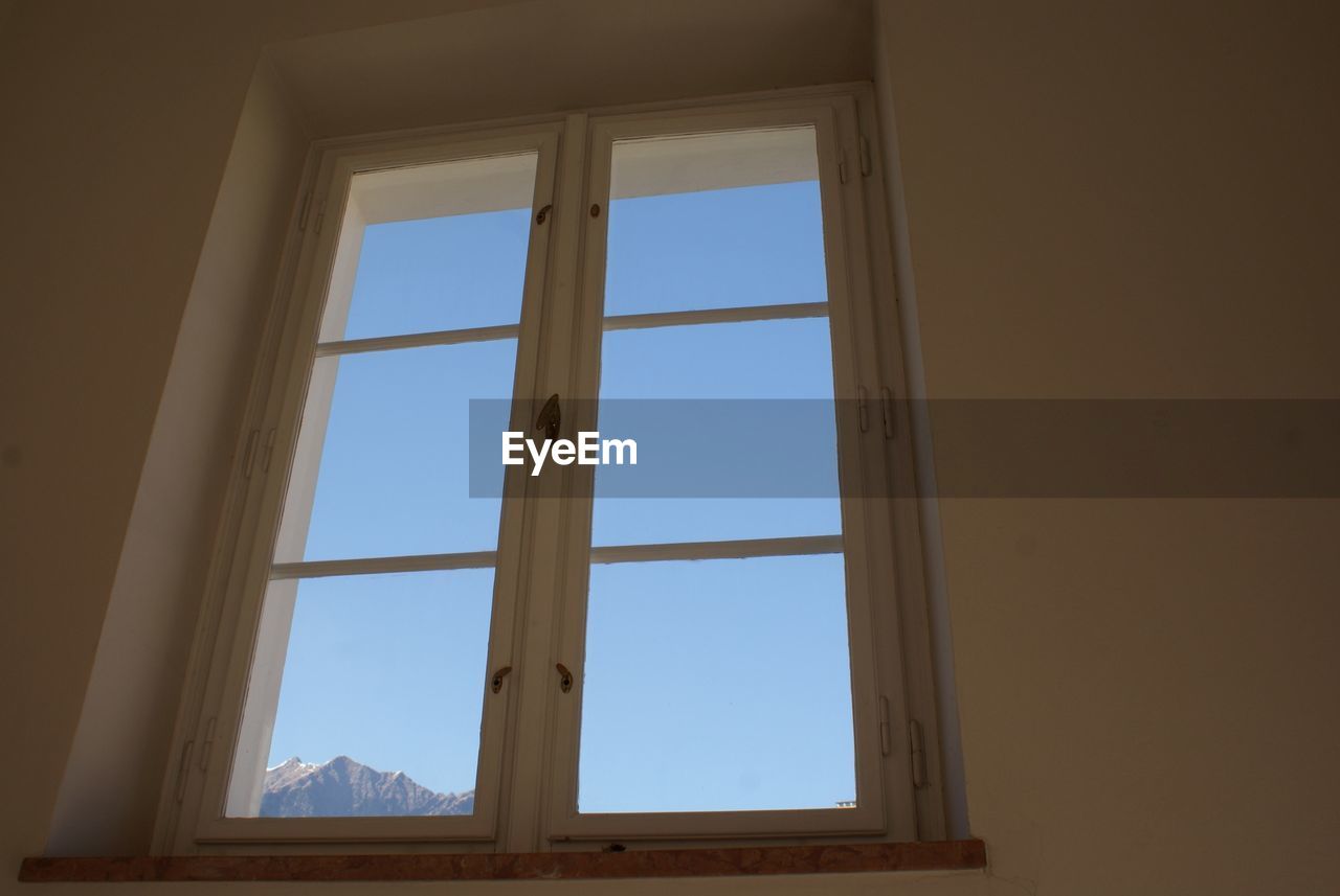 Mountain viewed through window