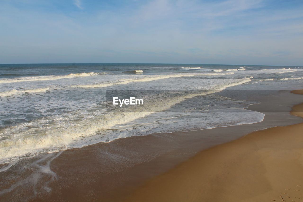 Scenic view of beach against sky