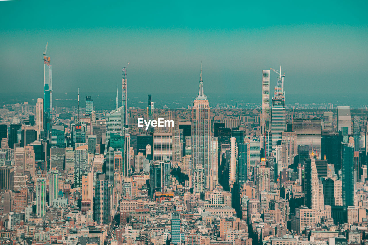 AERIAL VIEW OF BUILDINGS AGAINST SKY