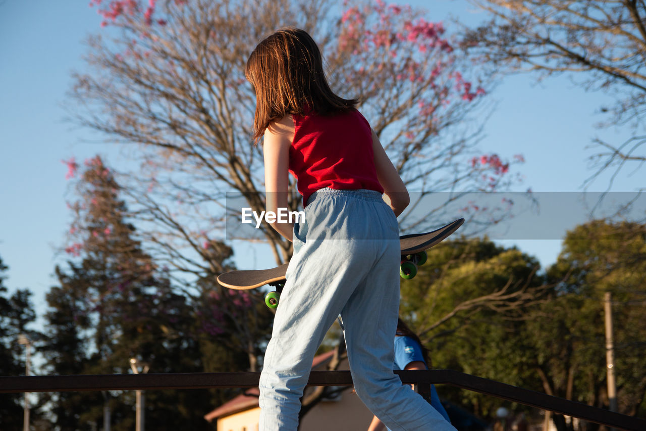 Teenage girl skateboarding