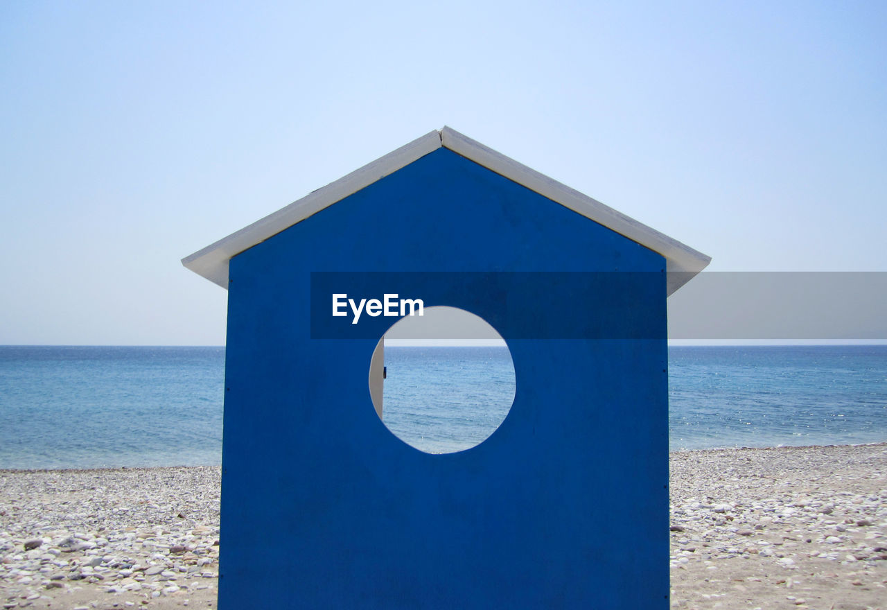 Beach hut with sea in background