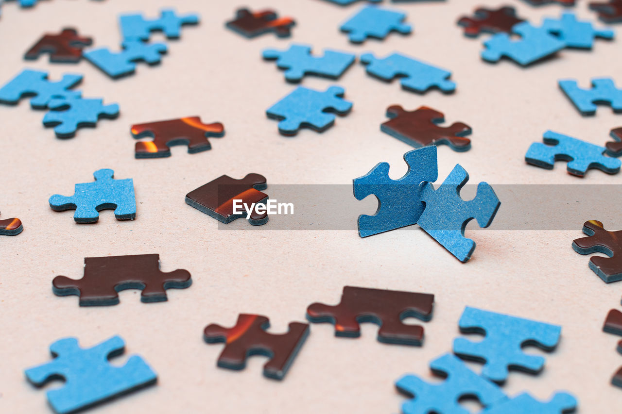 HIGH ANGLE VIEW OF MULTI COLORED TOY ON FLOOR