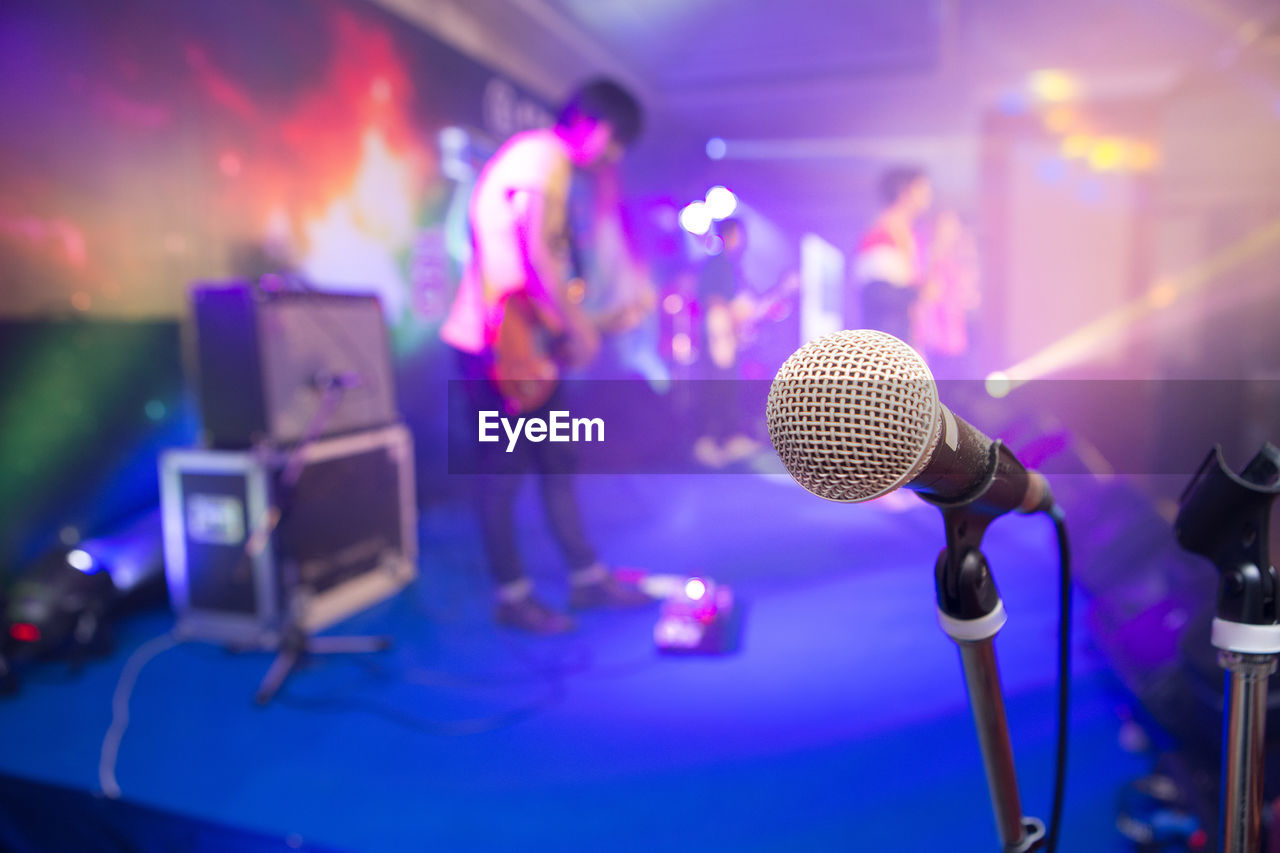 People performing on stage at music concert