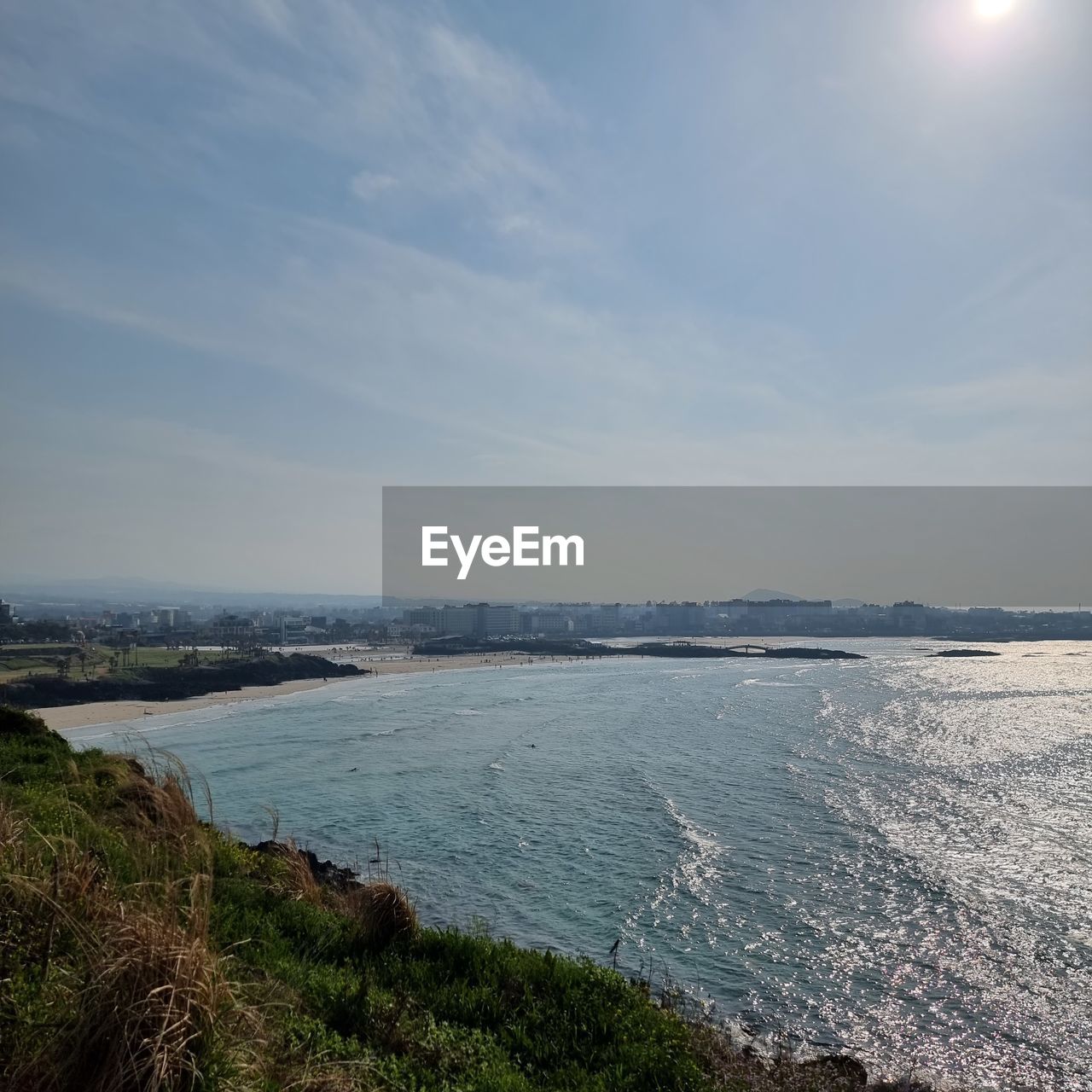water, nature, reflection, beauty in nature, sunlight, scenics - nature, cliff, day, no people, sky, mountain, sea, land, outdoors, tranquility, cloud, wave, terrain, tranquil scene, environment, motion, non-urban scene, morning, plant, coast, blue