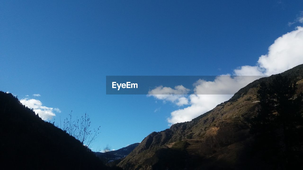 LOW ANGLE VIEW OF MOUNTAIN AGAINST SKY