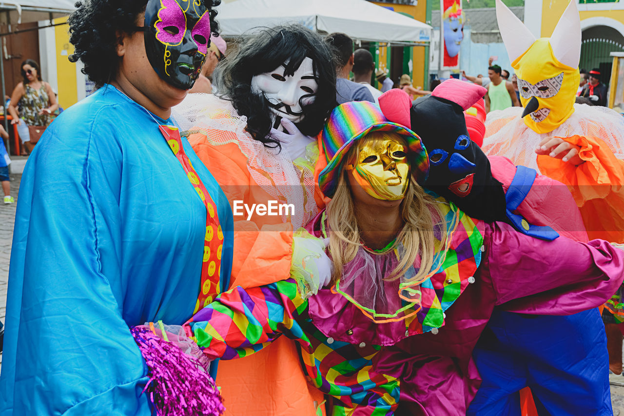 people wearing venice carnival style costumes during parties 