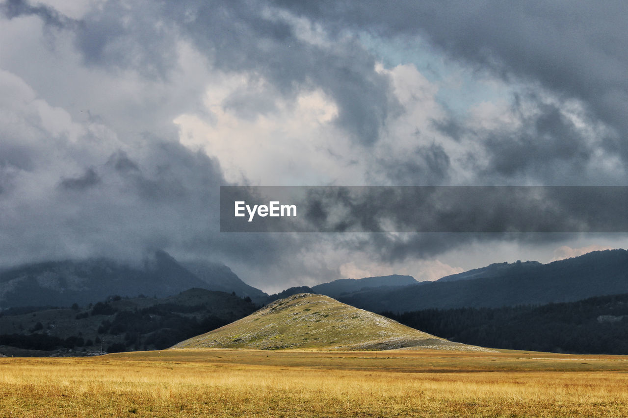 View of landscape against cloudy sky