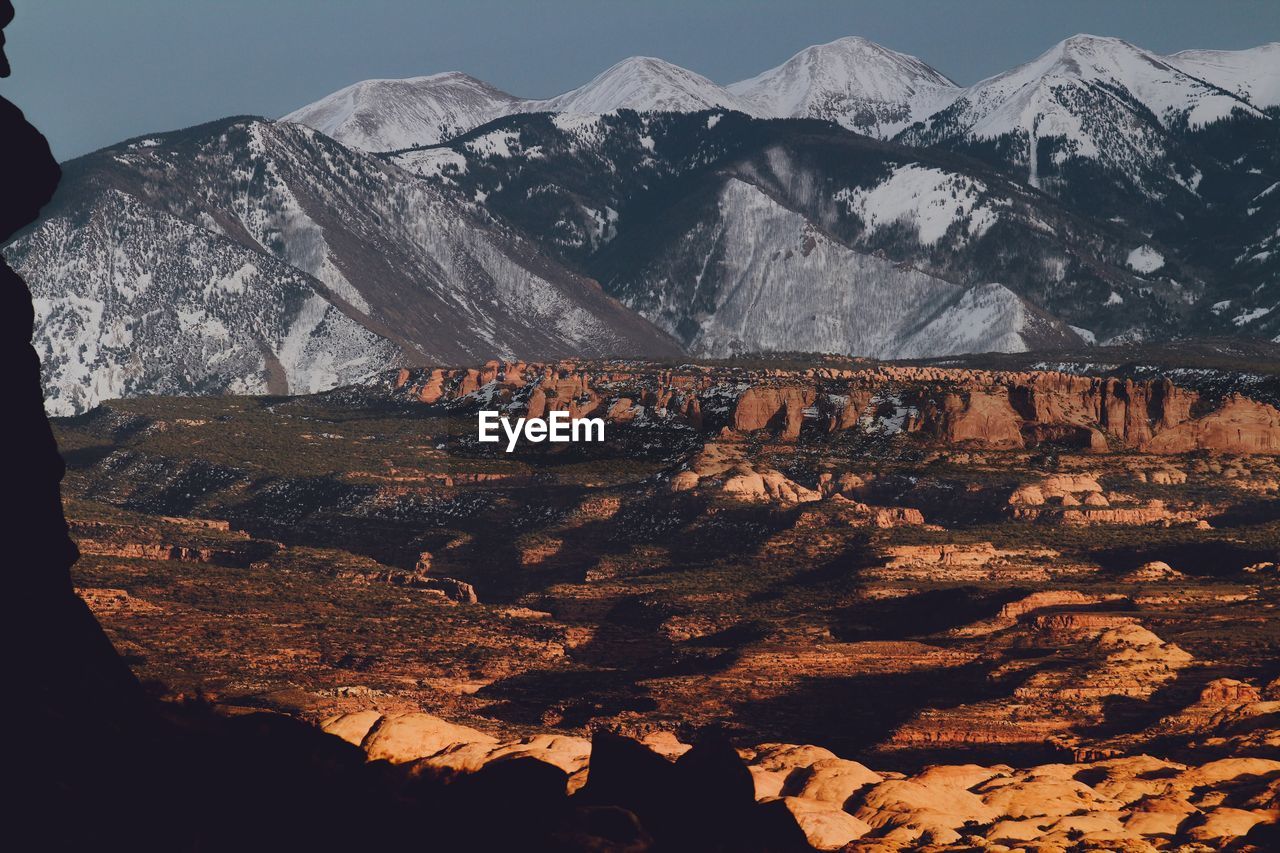 Aerial view of landscape with mountain range in background