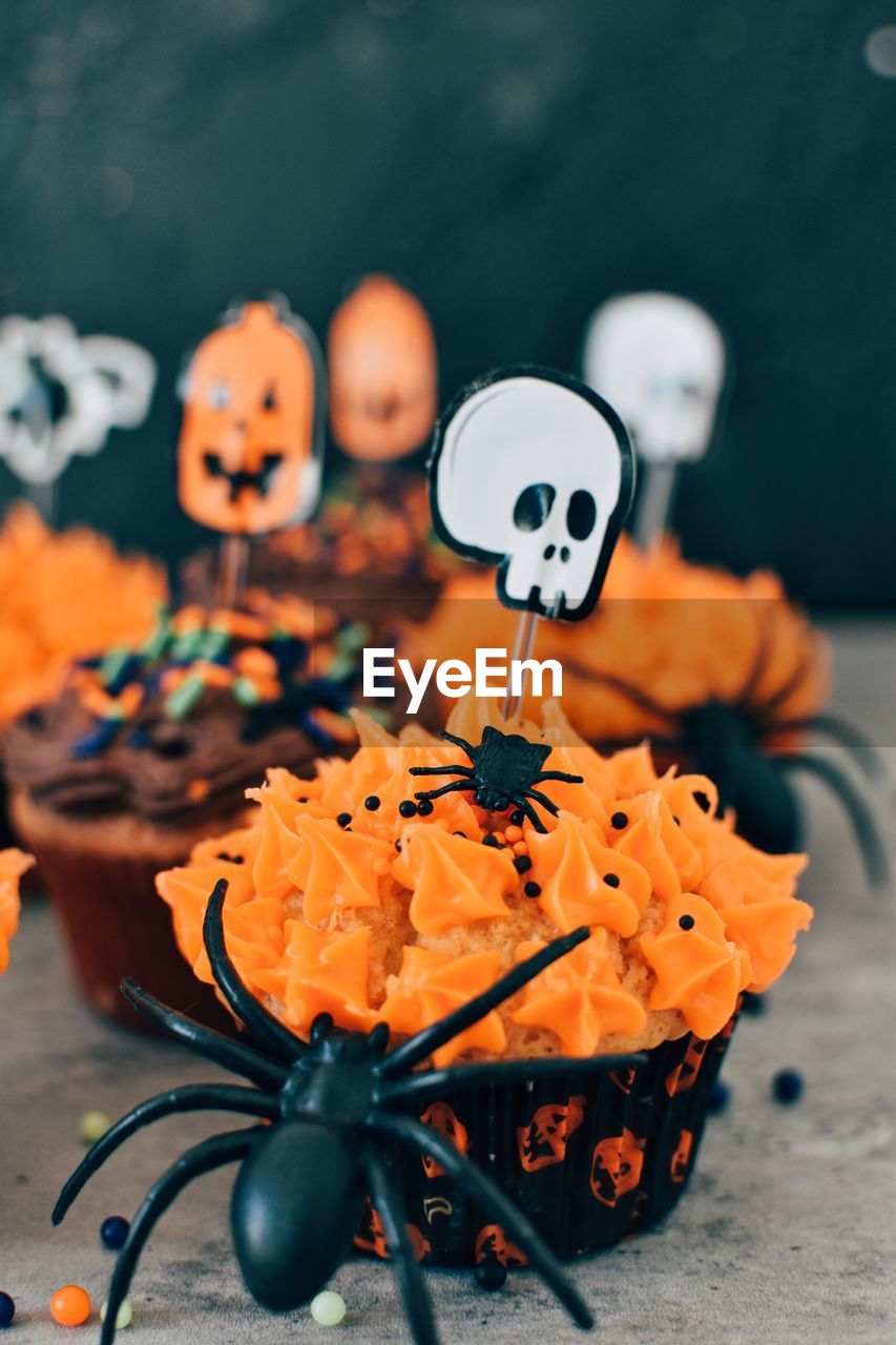 Close-up of halloween cupcakes on table
