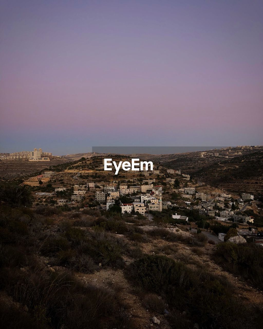 High angle view of buildings against clear sky