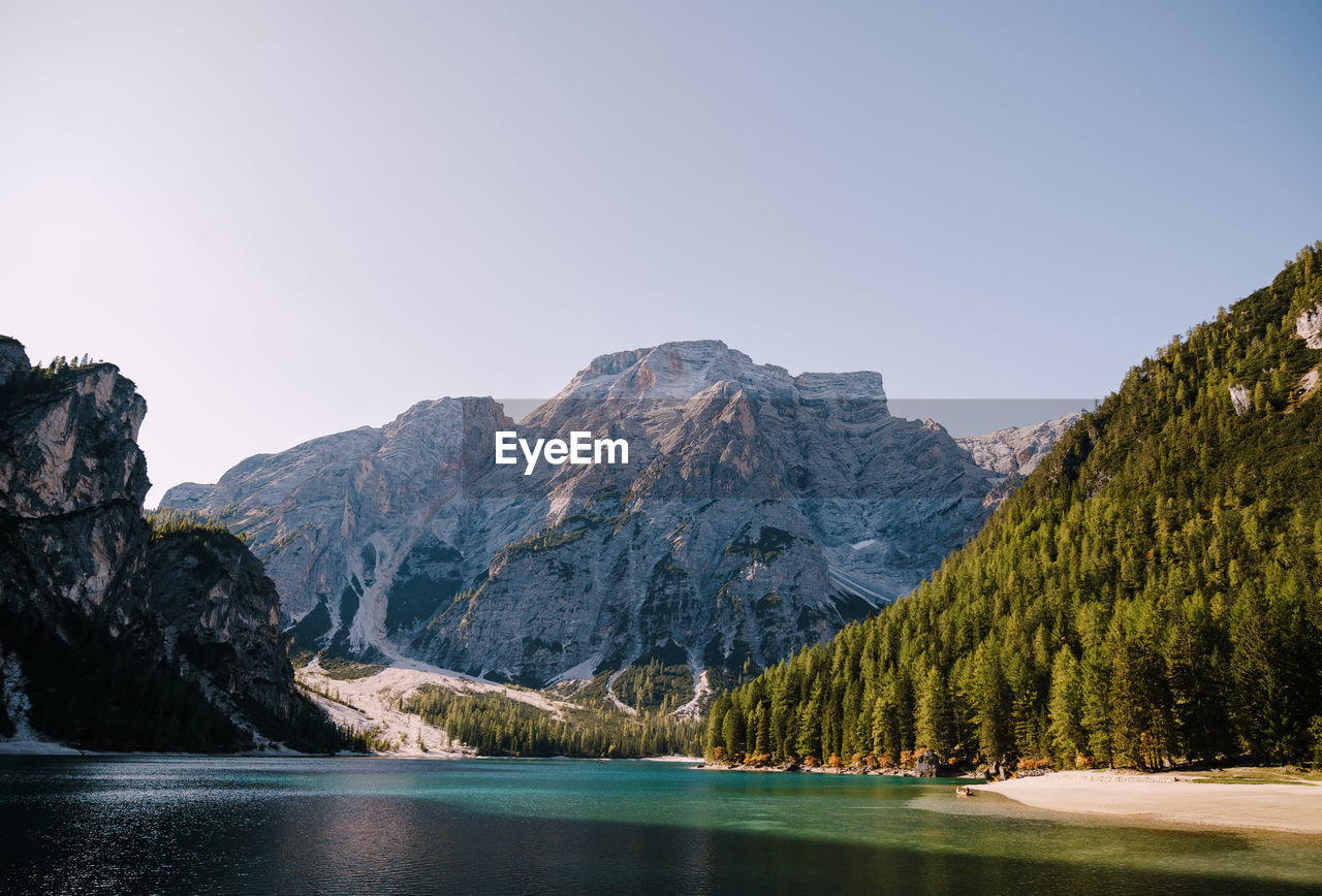 PANORAMIC VIEW OF LAKE AND MOUNTAINS AGAINST CLEAR SKY