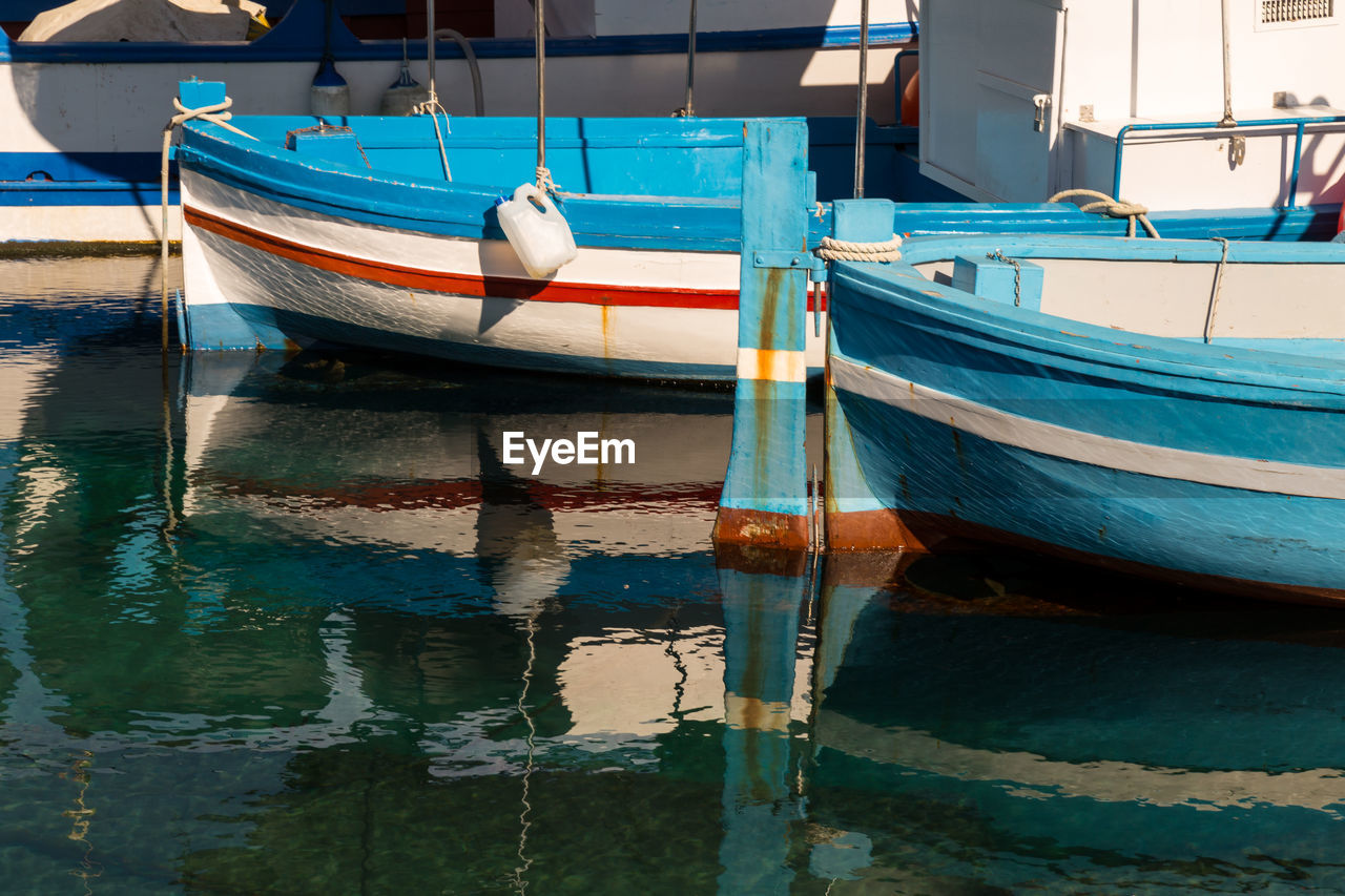 Small traditional fishing boat, made of wood, coloured, painted, sicily