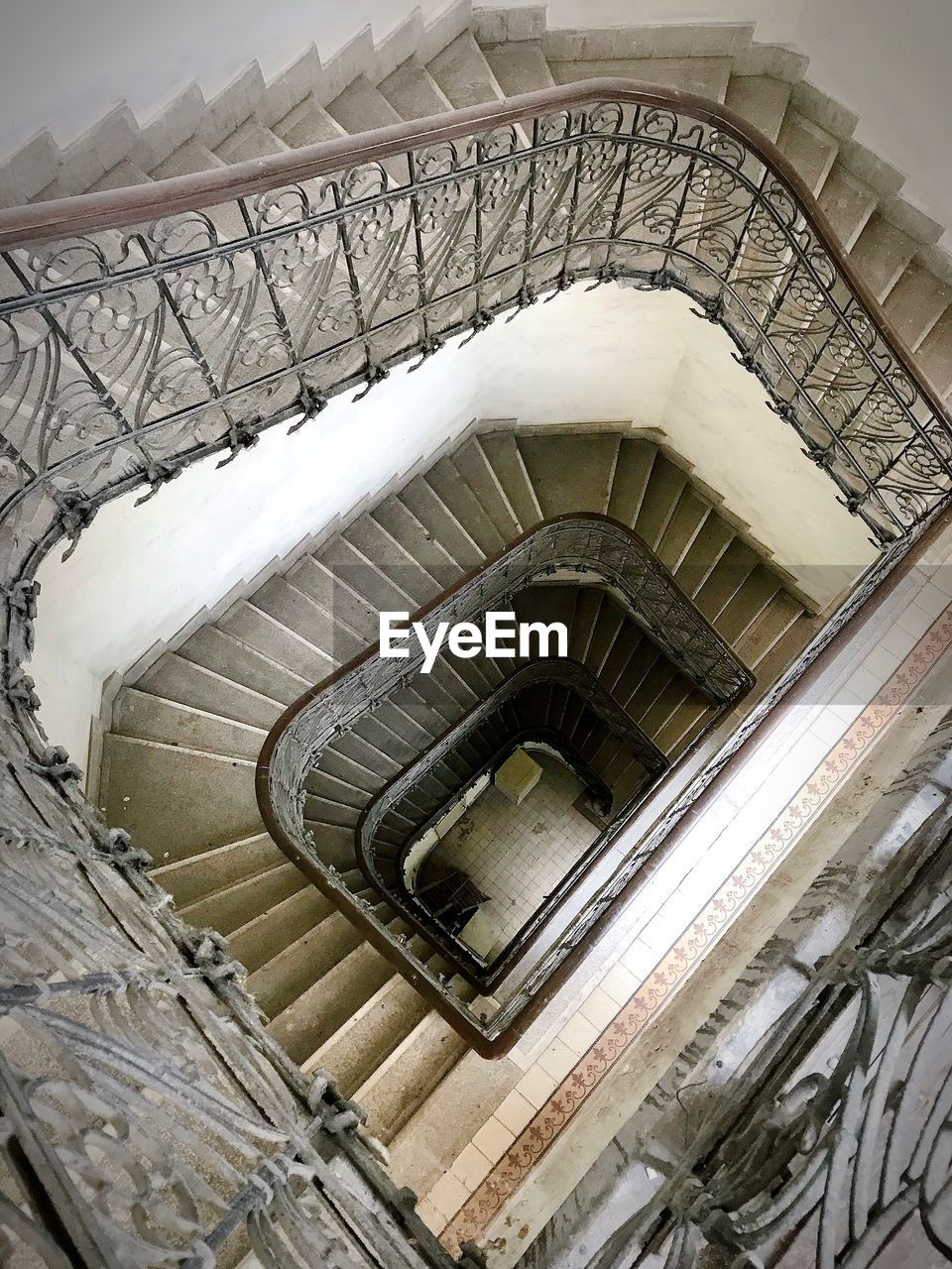 Directly below shot of spiral staircase in building