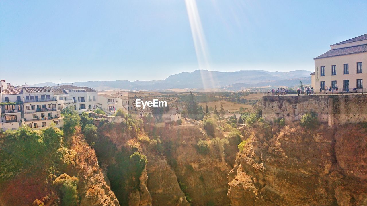 Panoramic view of buildings in town against clear sky