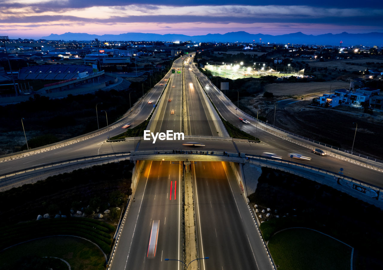 High angle view of illuminated bridge in city at night