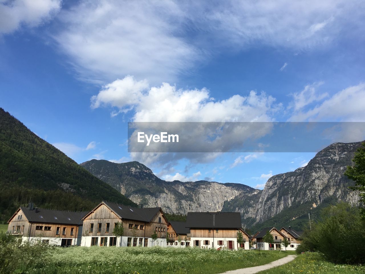 Scenic view of mountains against blue sky