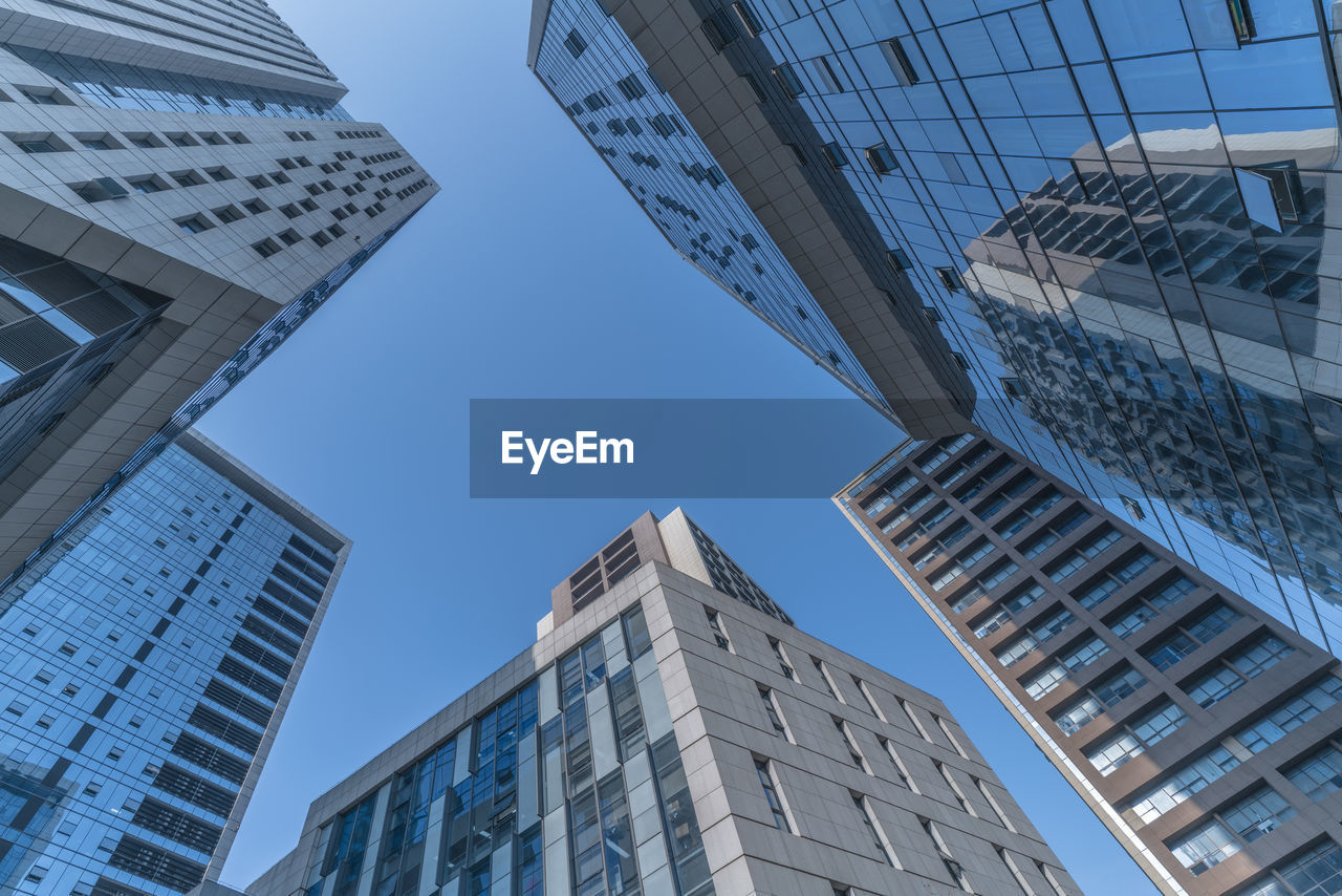 Low angle view of modern buildings against sky