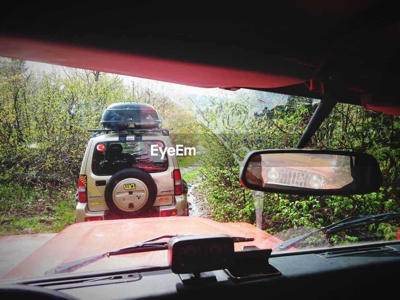 CLOSE-UP OF VINTAGE CAR ON SIDE-VIEW MIRROR