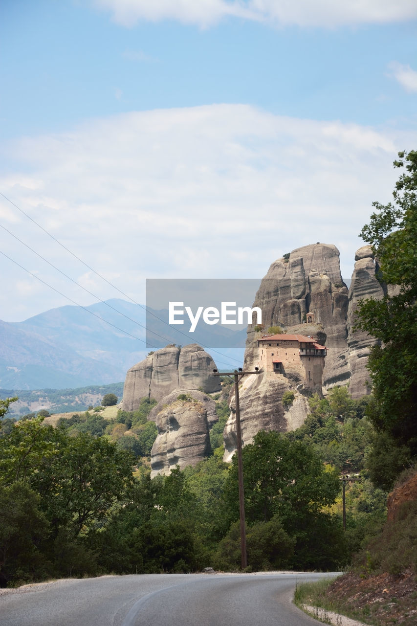 architecture, sky, built structure, nature, vacation, travel destinations, tree, cloud, plant, mountain, building exterior, travel, rock, day, history, no people, the past, tourism, building, city, outdoors, transportation, landmark, scenics - nature, road, beauty in nature, landscape