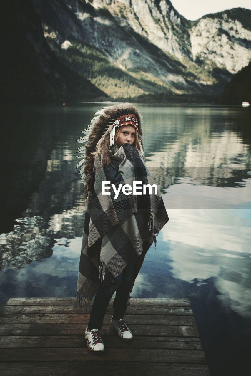 PORTRAIT OF WOMAN STANDING IN LAKE