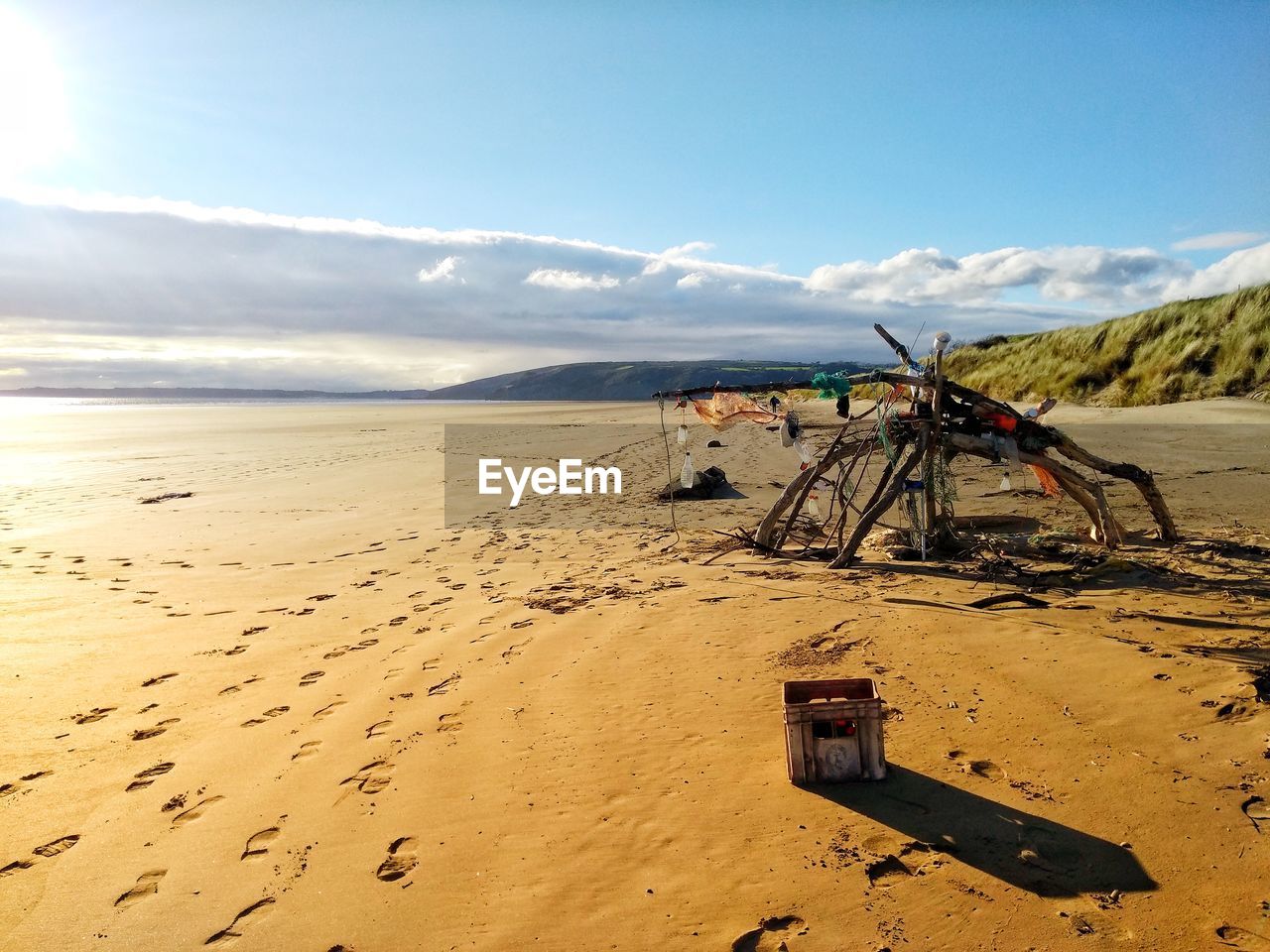 SCENIC VIEW OF SAND DUNES AGAINST SKY