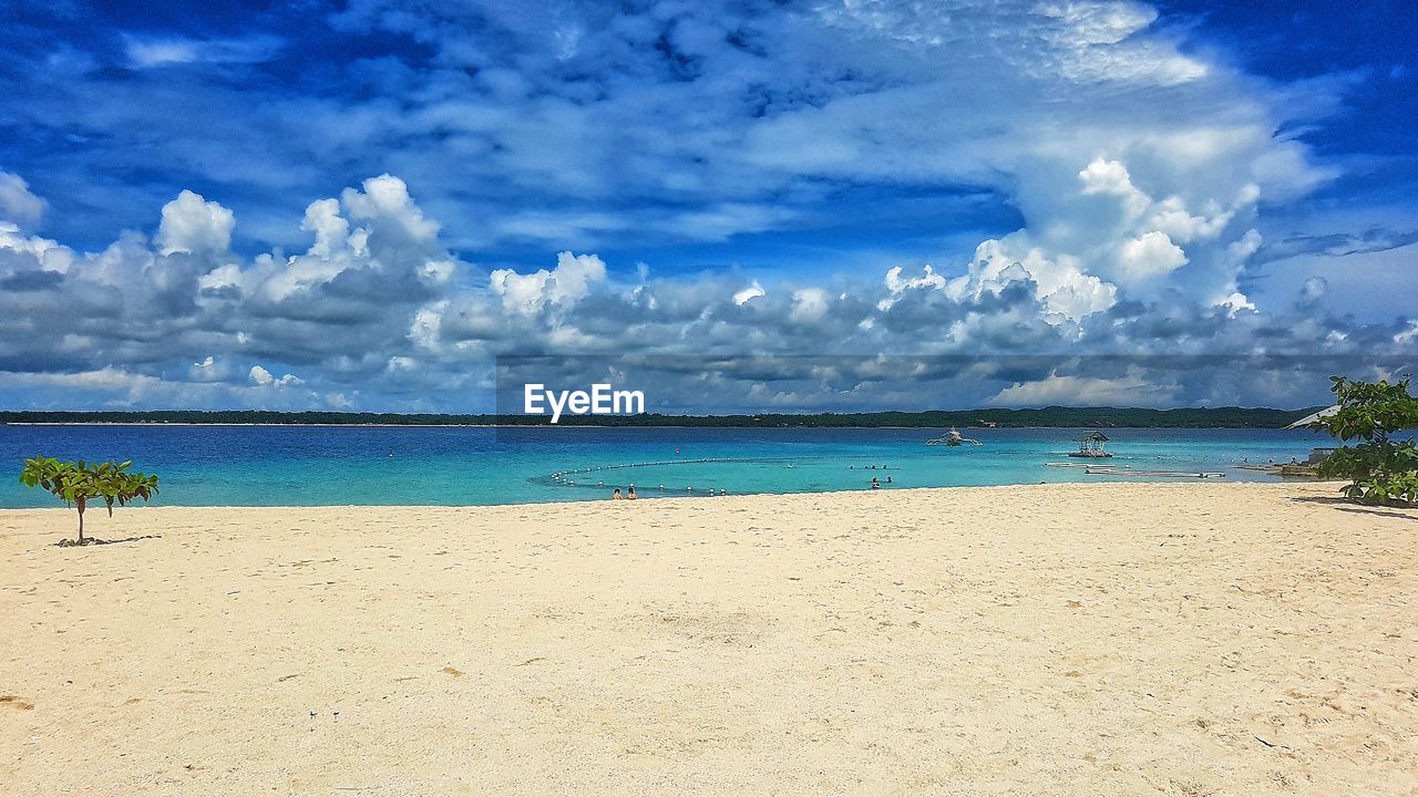 PANORAMIC VIEW OF BEACH AGAINST SKY