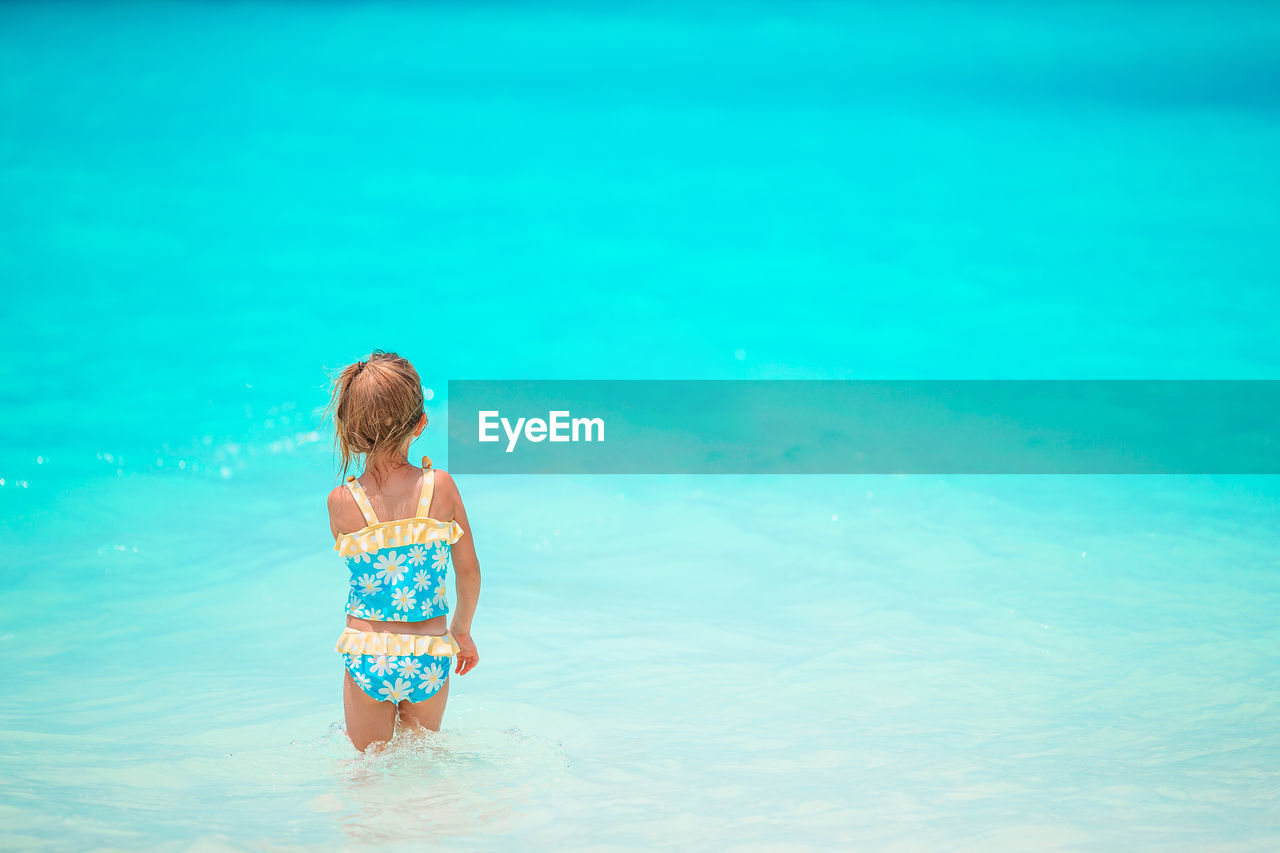 Full length of woman in swimming pool