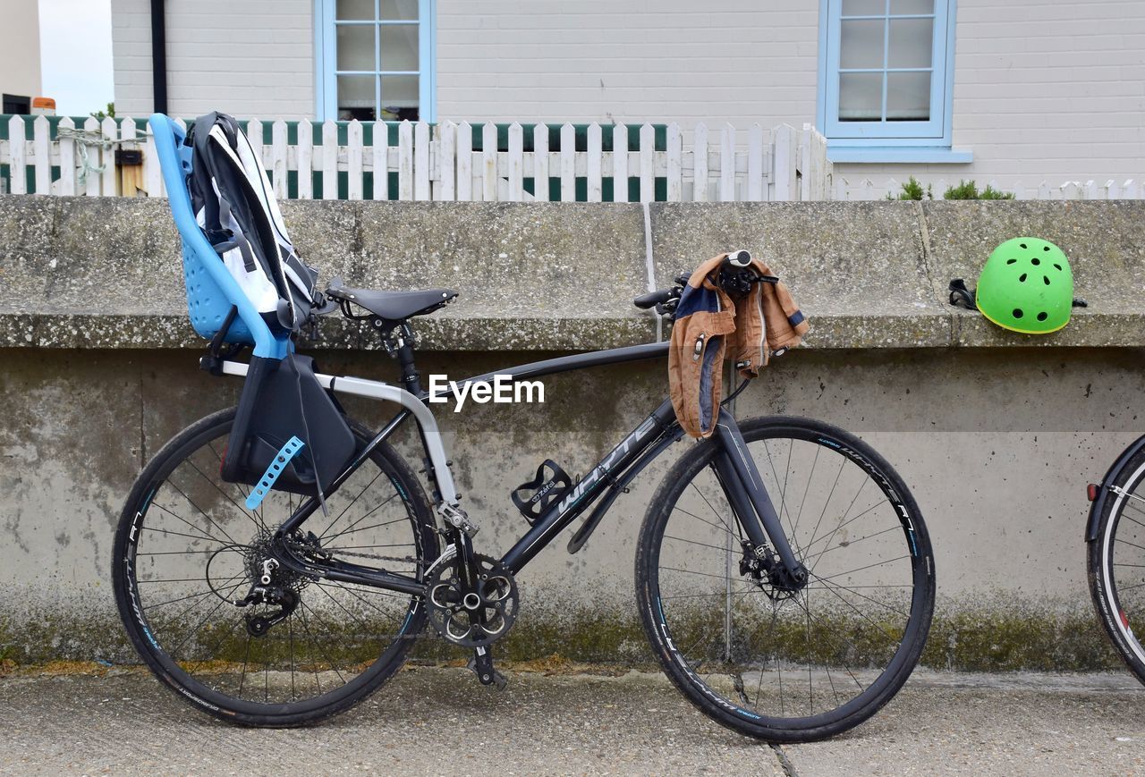 BICYCLES ON STREET AGAINST BUILDINGS