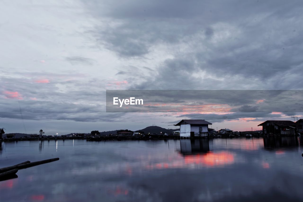 Scenic view of lake against sky during sunset