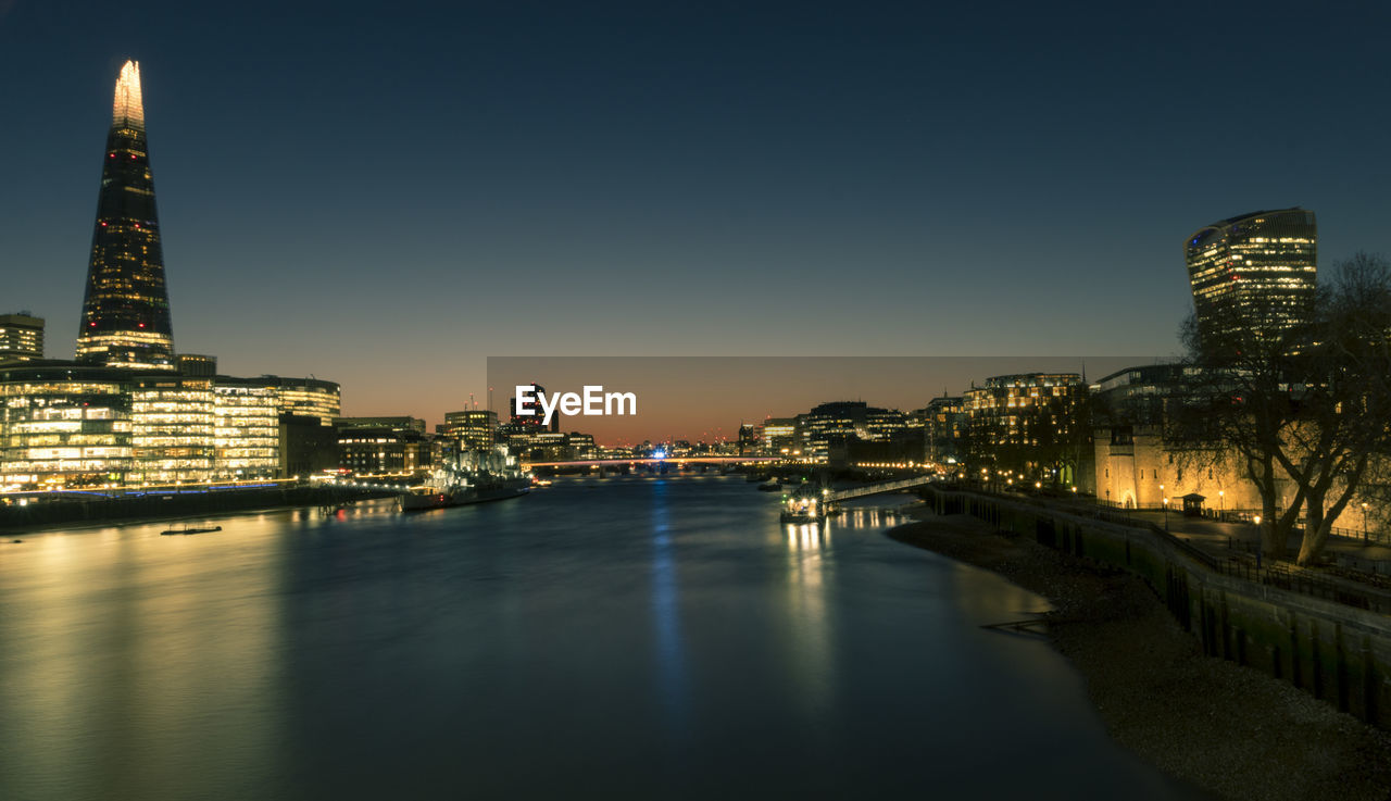 illuminated buildings in water