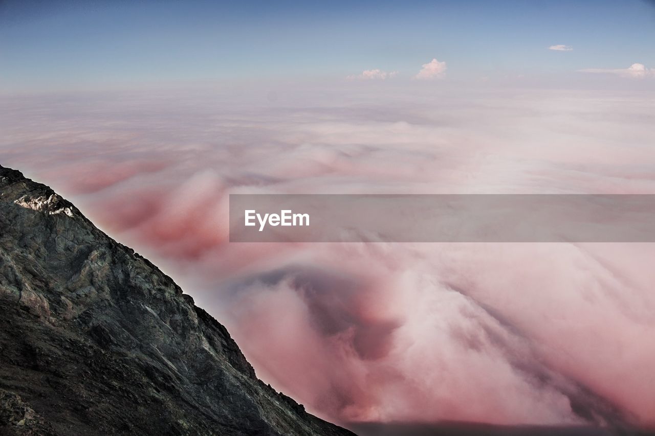 Scenic view of mountains against sky during sunset