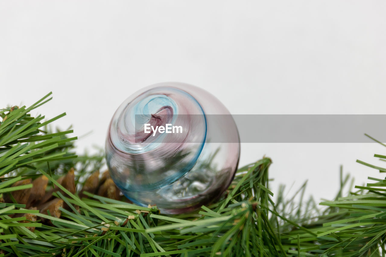 High angle view of glass ornament on table