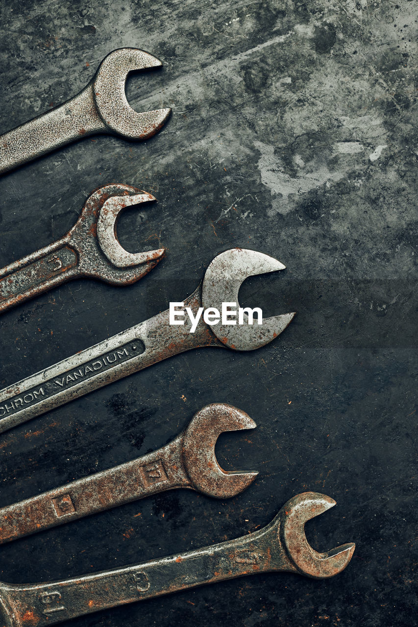 Spanners on steel surface. old rusty wrenches for maintenance. mechanic hardware tools to fix
