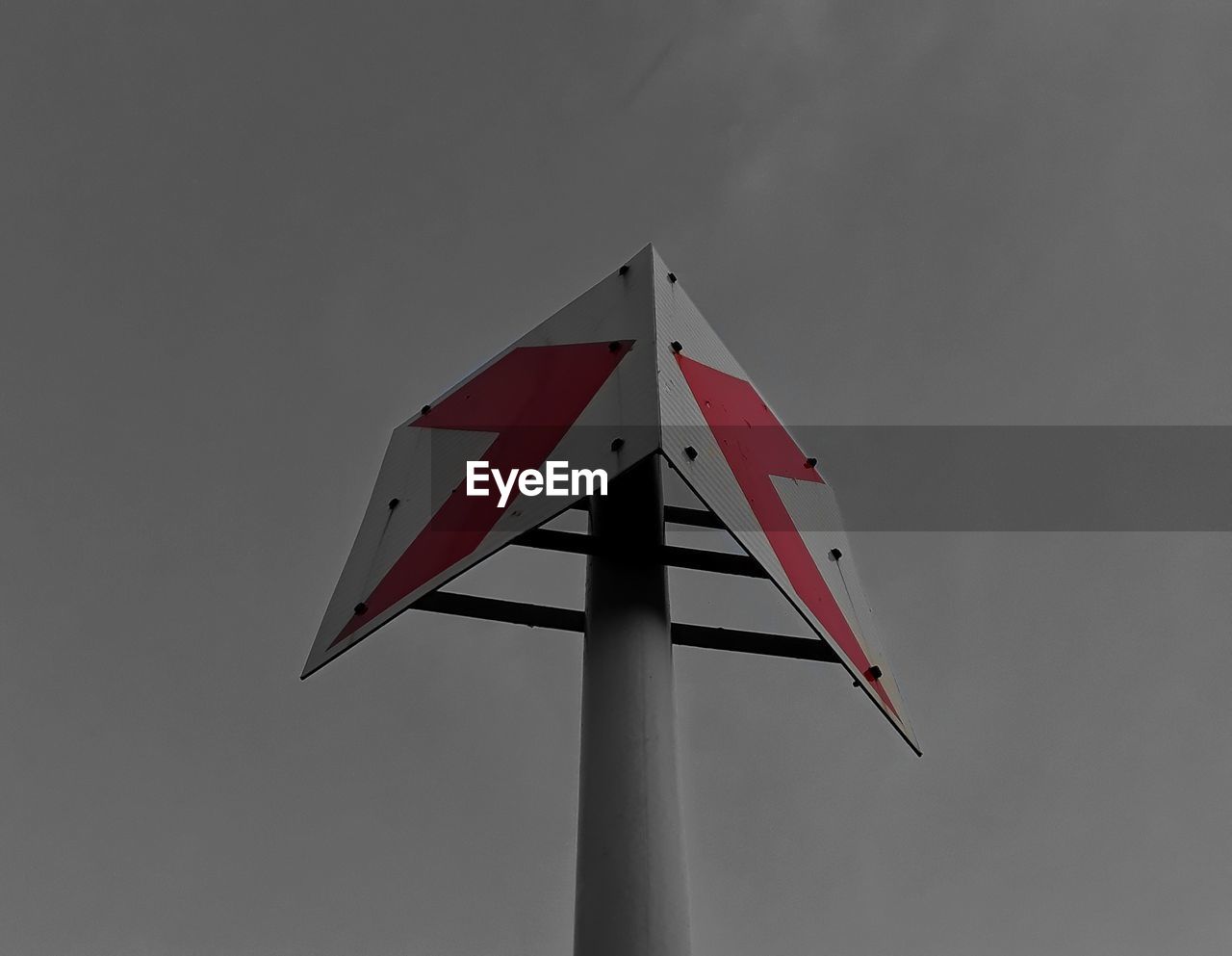 LOW ANGLE VIEW OF RED POLE AGAINST SKY