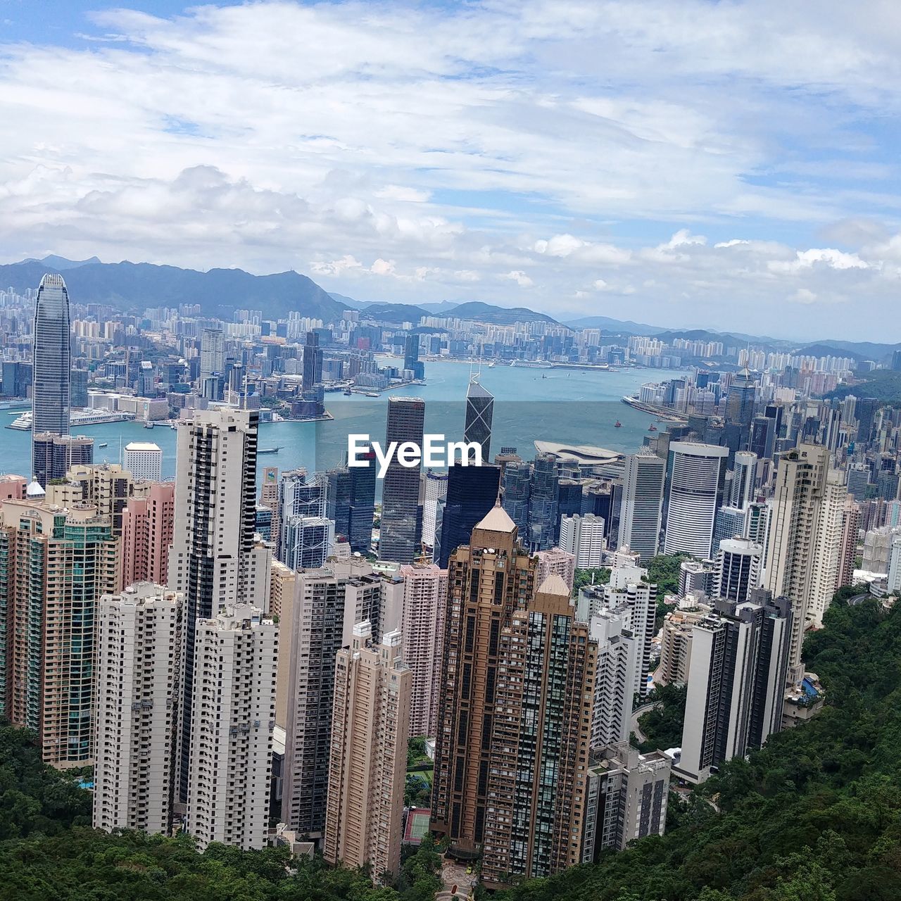 Aerial view of modern buildings in city against sky