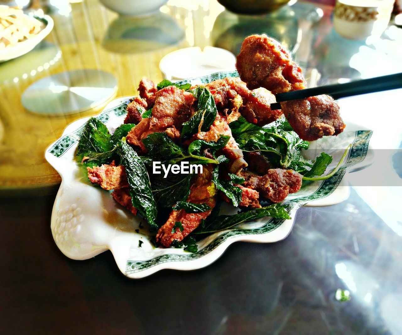 CLOSE-UP OF FOOD SERVED ON TABLE